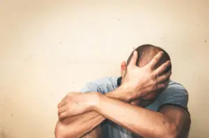 man suffering from addiction