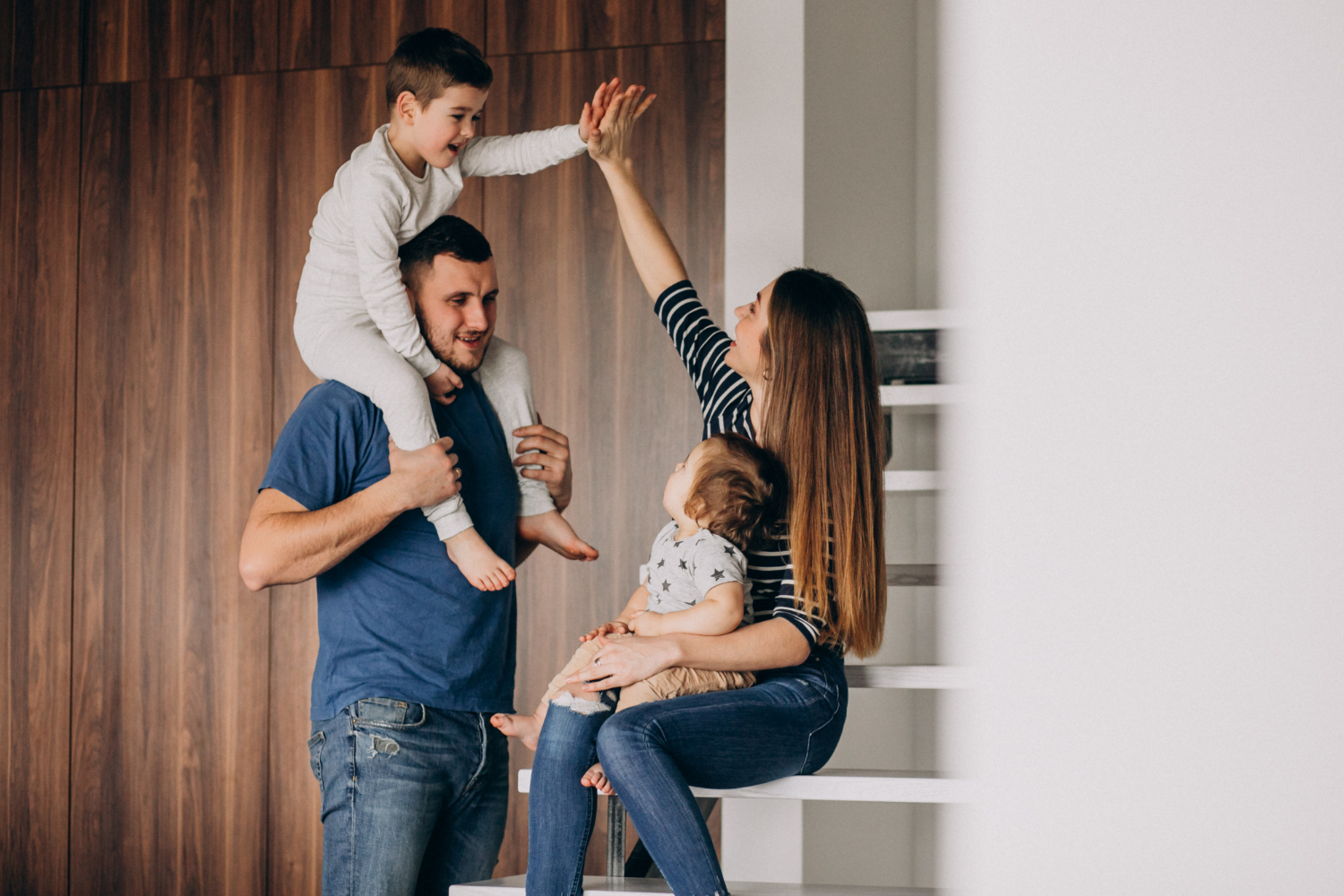 young-family-with-their-little-son-home-having-fun