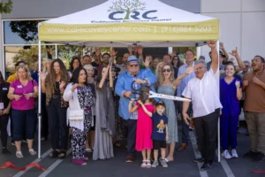 Attendees pose for photo at CRC's opening of its new behavioral health facility